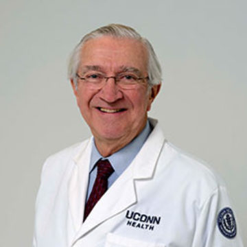 Headshot of Peter Deckers, MD in a white coat