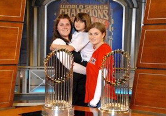Nicole with kids with World Series trophies.